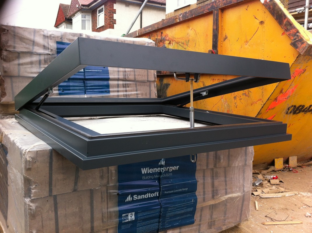 Opening flat roof skylight in anthracite grey installed in Leighton Buzzard