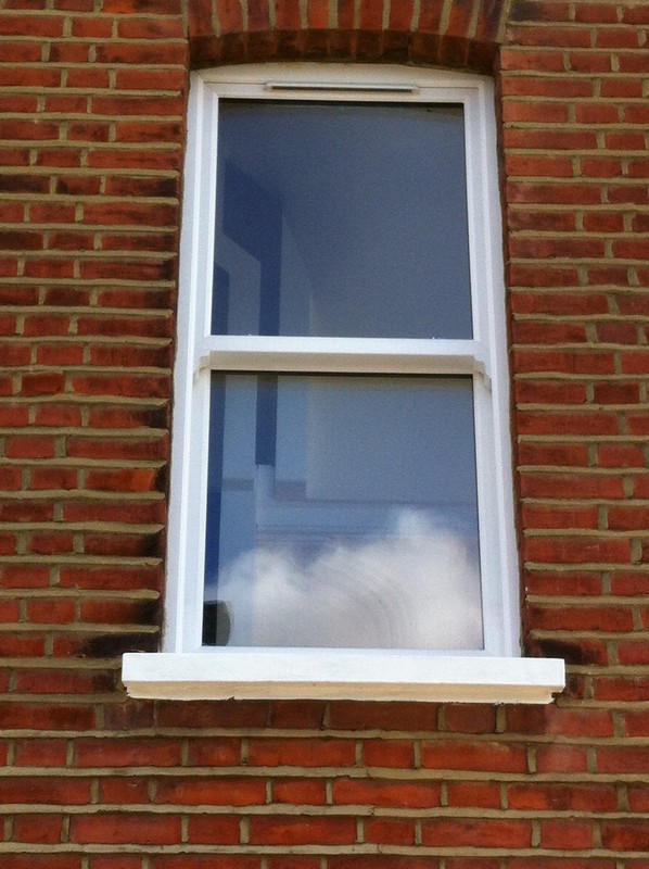 uPVC sash window on Victorian red brick house in Leighton Buzzard
